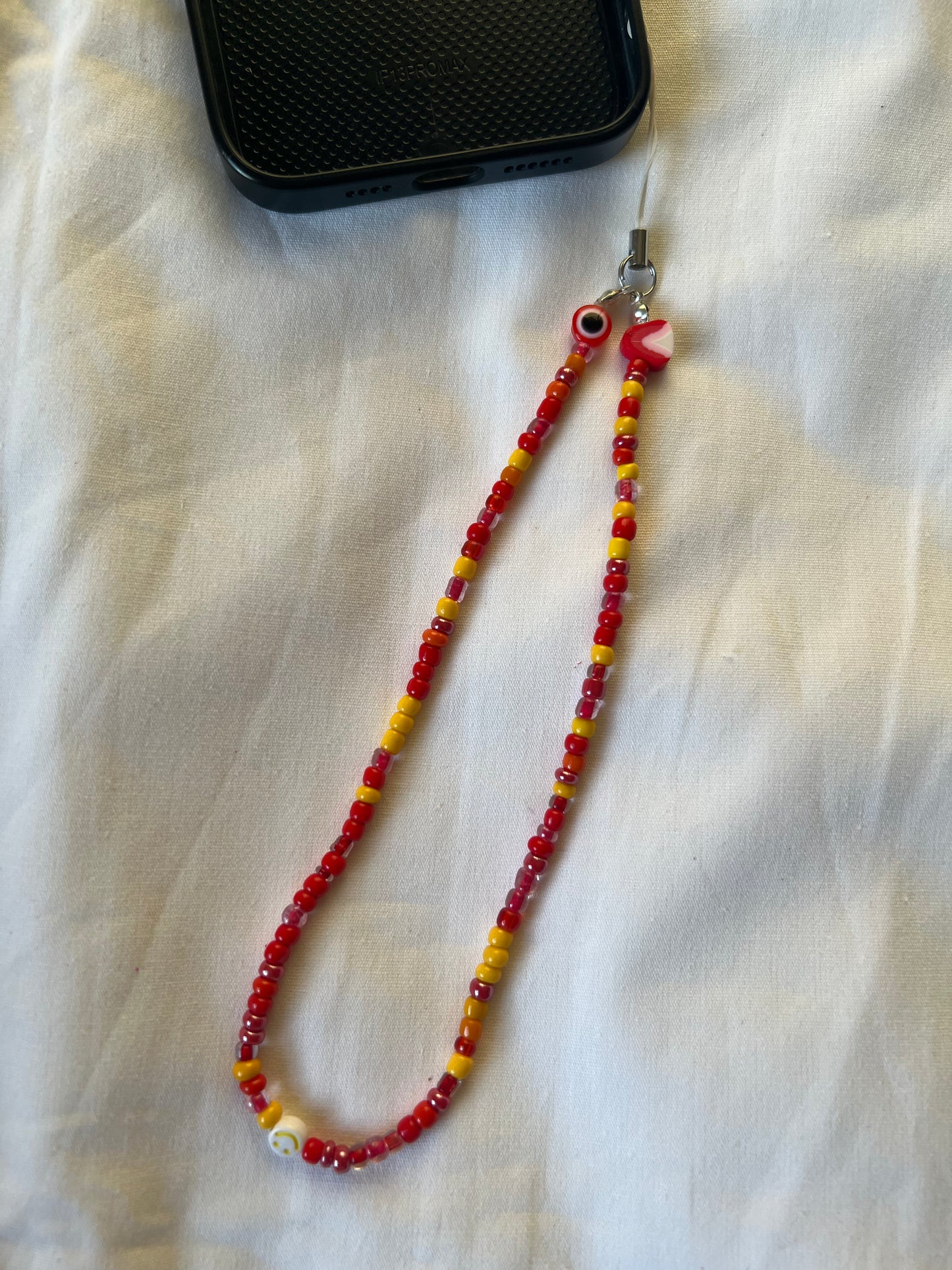 Red | Yellow phone charm